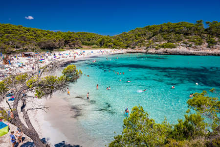 CALA MONDRAGO, Majorka, Spain, 24 July 2020 - People enjoy famous beach in summer, Parque Natural de Mondrago. Santanyi. Malorca. Spainのeditorial素材