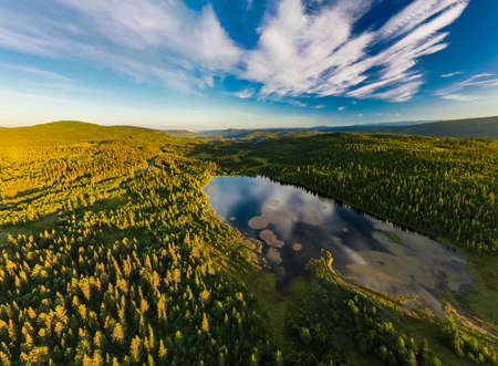 Bamselitjernet lake near Beitostolen surrounded by forests during the sunset, Norwayの写真素材