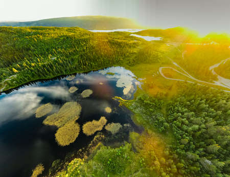 Bamselitjernet lake near Beitostolen surrounded by forests during the sunset, Norwayの写真素材