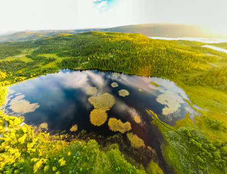 Bamselitjernet lake near Beitostolen surrounded by forests during the sunset, Norwayの写真素材