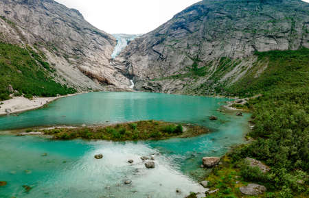 Briksdalsbreen is a glacier arm of Jostedalsbreen, and a lake, Briksdalsbre, Norwayの写真素材