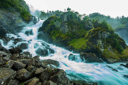 Famous Latefossen waterfall in Hordaland, Norway. Old stone bridge.の写真素材