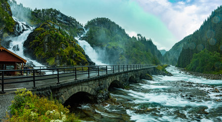 Famous Latefossen waterfall in Hordaland, Norway. Old stone bridge.