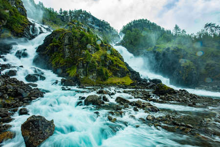 Famous Latefossen waterfall in Hordaland, Norway. Old stone bridge.の写真素材