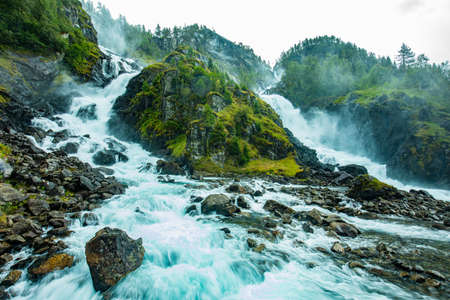 Famous Latefossen waterfall in Hordaland, Norway. Old stone bridge.の写真素材