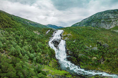 Nyastolfossen falls, the second in cascade of four waterfalls in Husedalen valley, Kinsarvik, Norwayの写真素材