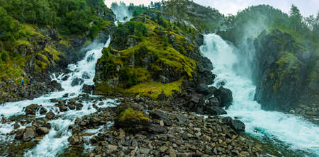 Famous Latefossen waterfall in Hordaland, Norway. Old stone bridge.の写真素材