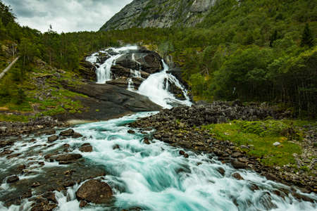 Nyastolfossen falls, the second in cascade of four waterfalls in Husedalen valley, Kinsarvik, Norwayの写真素材