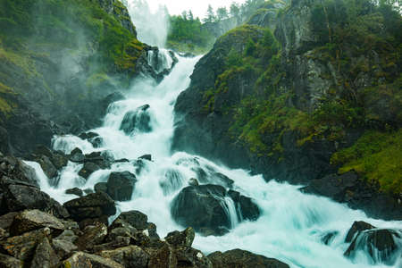 Famous Latefossen waterfall in Hordaland, Norway. Old stone bridge.の写真素材