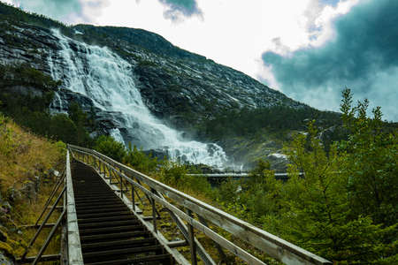 With a total drop of 612 metres, Langfoss (Langfossen) is the fifth highest waterfall in Norway.の写真素材