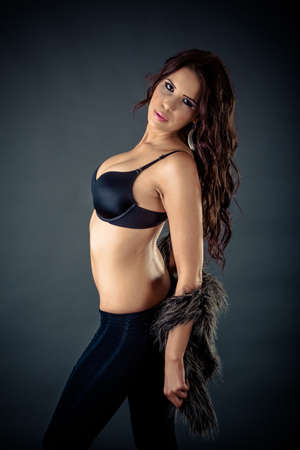Elegant fashionable woman in black lingerie in studio, high fashionの写真素材