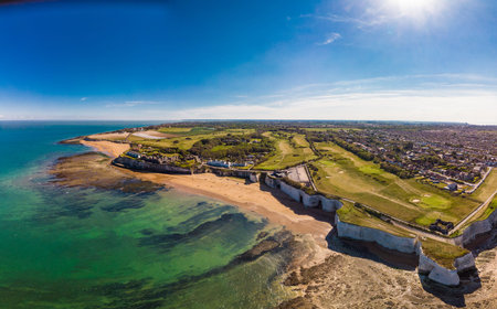 Drone aerial view of the beach and white cliffs on sunny day, Margate, England, UK
