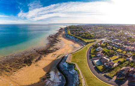 Drone aerial view of the beach and white cliffs on sunny day, Margate, England, UKの写真素材