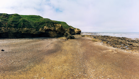 Sunny Cliffs and beach at Blackhall Rocks and Cromdon Dene Beachの写真素材