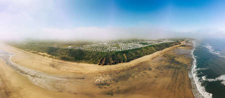 Sunny Cliffs and beach at Blackhall Rocks and Cromdon Dene Beachの写真素材