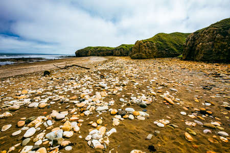 Sunny Cliffs and beach at Blackhall Rocks and Cromdon Dene Beachの写真素材