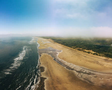 Sunny Cliffs and beach at Blackhall Rocks and Cromdon Dene Beachの写真素材