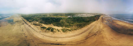 Sunny Cliffs and beach at Blackhall Rocks and Cromdon Dene Beachの写真素材