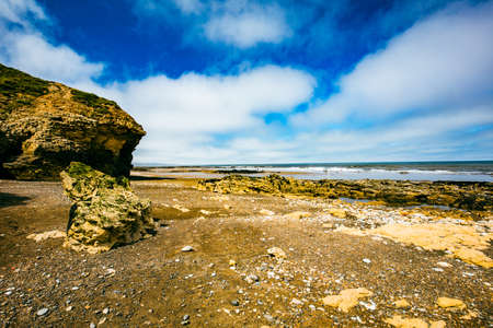 Sunny Cliffs and beach at Blackhall Rocks and Cromdon Dene Beachの写真素材