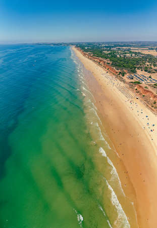 Aerial drone beach view of Vilamoura and Praia de Falesia, Algarve, Portugalの写真素材