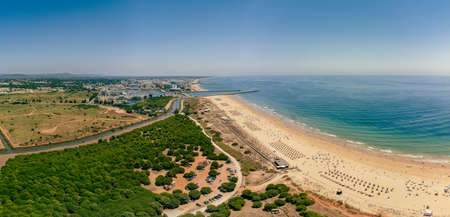 Aerial drone beach view of Vilamoura and Praia de Falesia, Algarve, Portugalの写真素材