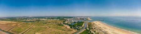 Aerial drone beach view of Vilamoura and Praia de Falesia, Algarve, Portugalの写真素材