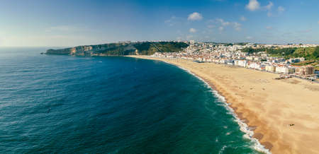 Aerial drone panorama view of Nazare, Portugal - town, ocean and beachの写真素材