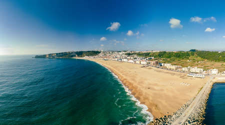 Aerial drone panorama view of Nazare, Portugal - town, ocean and beachの写真素材