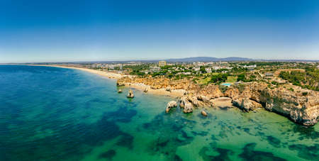 Aerial and panoramic view of Praia dos Tres Irmaos beach, Alvor, Algarve, Portugalの写真素材