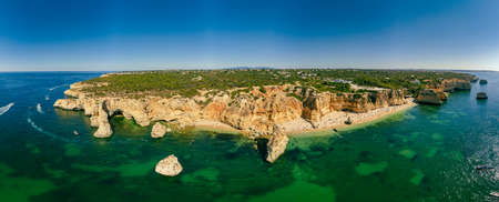 Aerial drone views of Praia da Marinha and Malhada do Baraco - beaches in Algarve, Portugalの写真素材