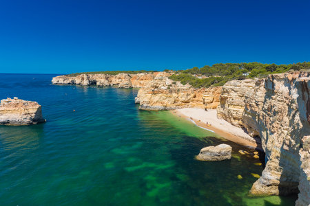 Aerial drone views of Praia da Marinha and Malhada do Baraco - beaches in Algarve, Portugalの写真素材