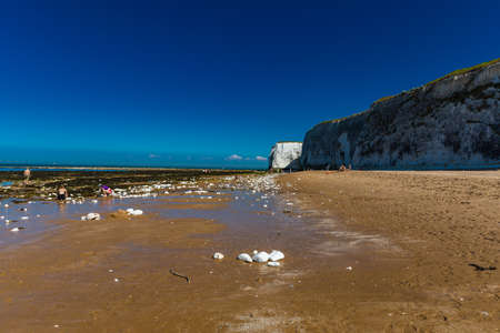 MARGATE, Kent, UK: 21 May 2020: Visitors to Margate's Main Sands beach surrounded by white cliffs during the heatwave in Britain.のeditorial素材