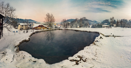 Travertine lake with hot water close to the spa Vysne Ruzbachy, Slovakia, during winterの写真素材