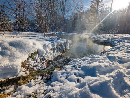 Travertine lake with hot water close to the spa Vysne Ruzbachy, Slovakia, during winterの写真素材