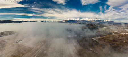 Drone view of Ganovce village with the view of High Tatras, Slovakiaの写真素材