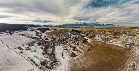 Drone view of Ganovce village with the view of High Tatras, Slovakiaの写真素材