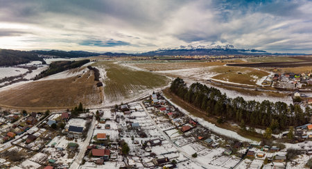 Drone view of Ganovce village with the view of High Tatras, Slovakiaの写真素材