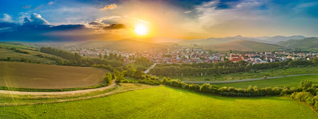 Aerial drone view of Podolinec, the town near Stara Lubovna, Slovakia, during sunsetの写真素材