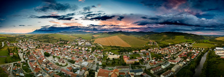Aerial drone view of Podolinec, the town near Stara Lubovna, Slovakia, during sunsetの写真素材
