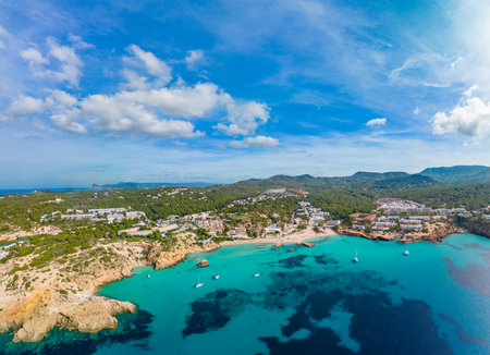 Aerial drone view of a beautiful coast and sea in Cala Tarida, Ibiza island, Spainの写真素材