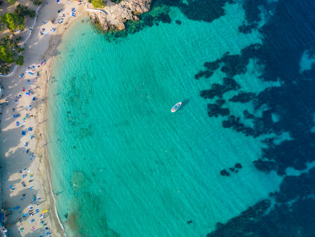 Ibiza Cala Bassa beach with turquoise water, aerial drone viewsの写真素材