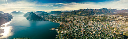 Lugano, Switzerland. Amazing aerial view of the Swiss city, surrounded by lake and mountains.の写真素材