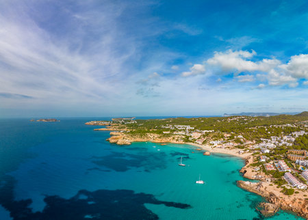 Aerial drone view of a beautiful coast and sea in Cala Tarida, Ibiza island, Spainの写真素材