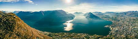 Lugano, Switzerland. Amazing aerial view of the Swiss city, surrounded by lake and mountains.の写真素材