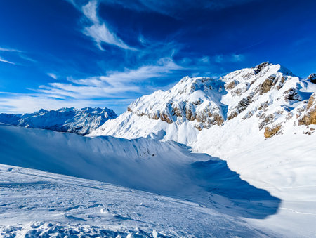 Ski slopes and mountains, Melchsee-Frutt mountain resort village, Switzerland in winterの写真素材