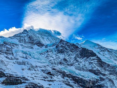 Ski slopes and mountains in famous Jungfrau ski resort in Swiss Alps, Grindelwald, Switzerlandの写真素材
