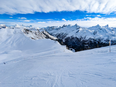 Snow covered mountains and ski slopes, ski area Stoos,Switzerlandの写真素材