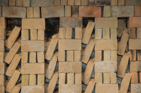 Brick factory. Baking bricks with sawdust on fire. Slow combustion. Bali, Indonesiaの写真素材