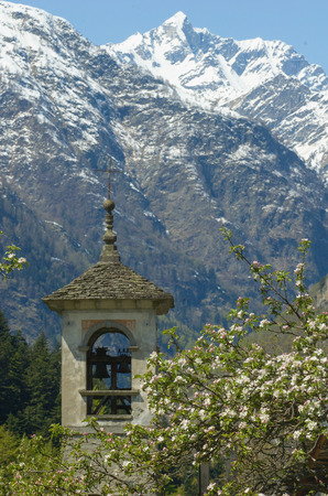 Bell tower and alpsの写真素材