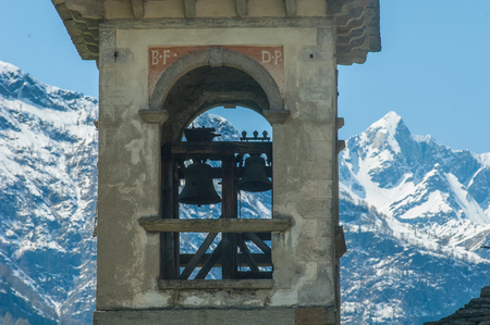 Bell tower and alpsの写真素材